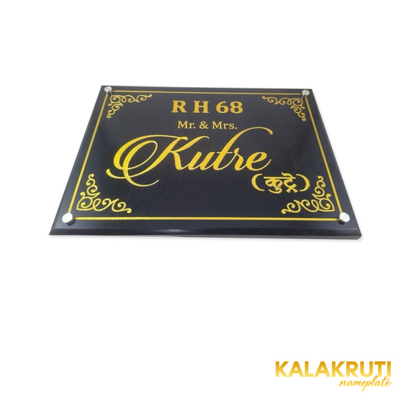 Kutre nameplate, low tabletop view showing the bevel and engraving on a white studio background