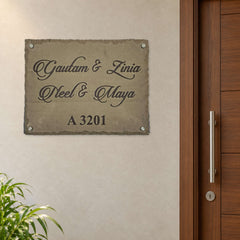 Gautam & Family nameplate shown installed beside an indoor apartment entrance door