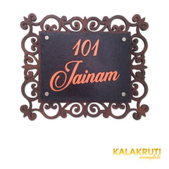 Jainam nameplate, level front view on a white studio background
