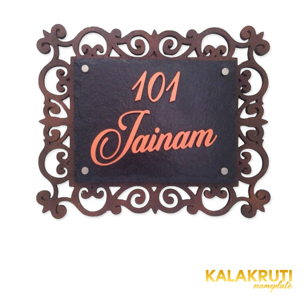 Jainam nameplate, level front view on a white studio background