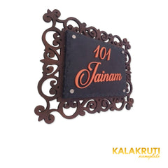Jainam nameplate, left oblique view on a white studio background