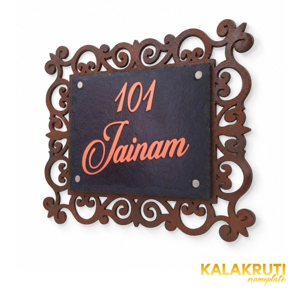 Jainam black stone nameplate with copper-colour101 and script, right oblique view showing the open ornamental MDF frame and four silver-tone caps