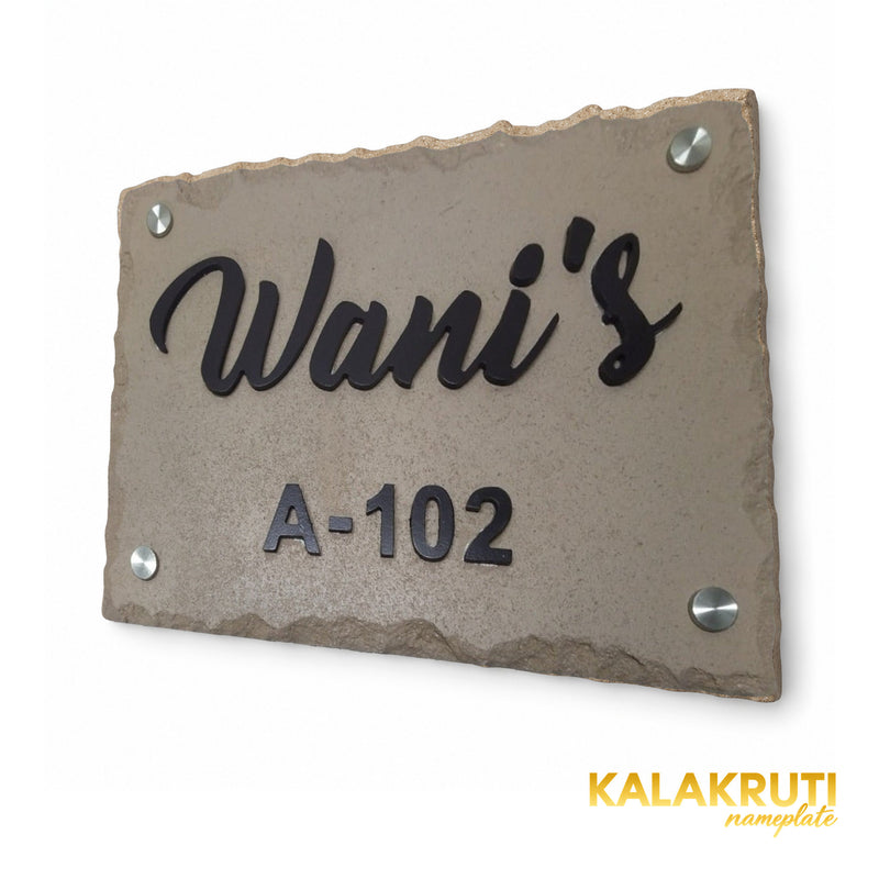 Wani sandstone and brown acrylic nameplate, right oblique view showing the original script, A-102 and silver-tone caps