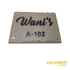 Wani nameplate, original low front angle showing the acrylic letter depth on a white studio background
