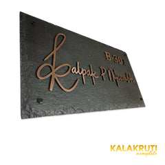 Kalpak nameplate, left oblique view on a white studio background