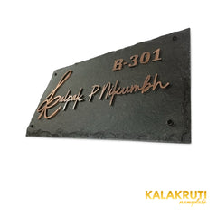 Kalpak nameplate, right oblique view on a white studio background
