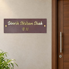 Dinesh Shriram Shah nameplate shown installed beside an indoor apartment entrance door