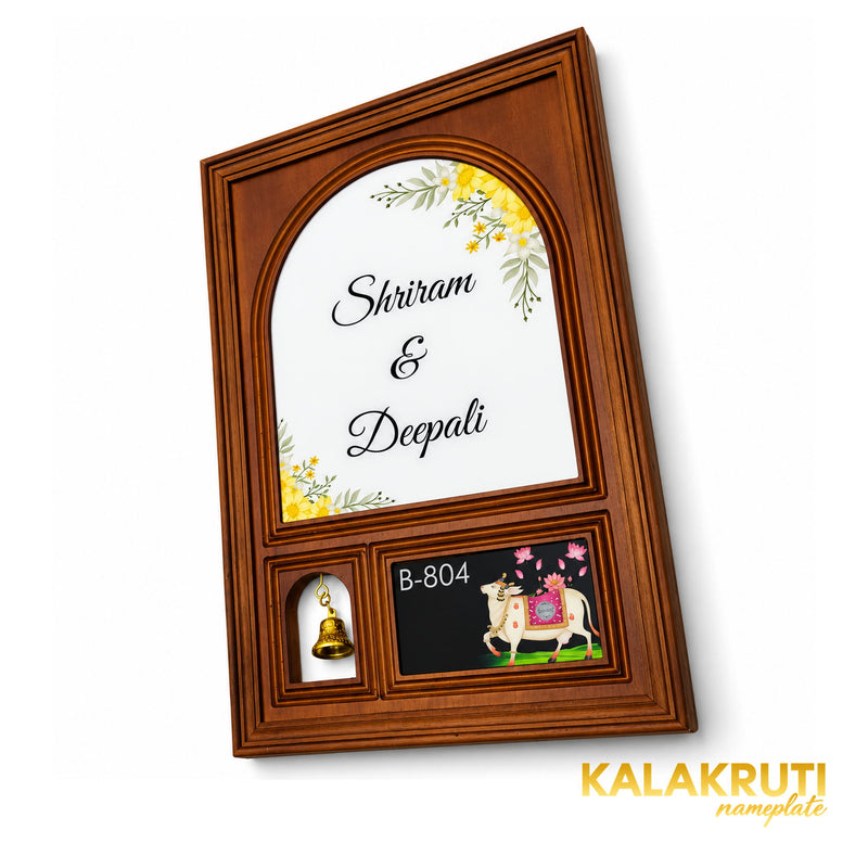 Retouched original diagonal oblique view of the Shriram and Deepali nameplate with floral print, bell and decorative cow artwork.